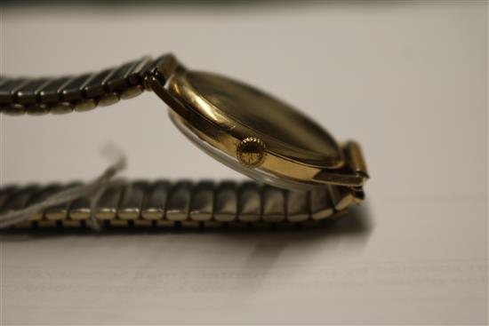 A gentlemans 9ct gold Longines manual wind wrist watch.